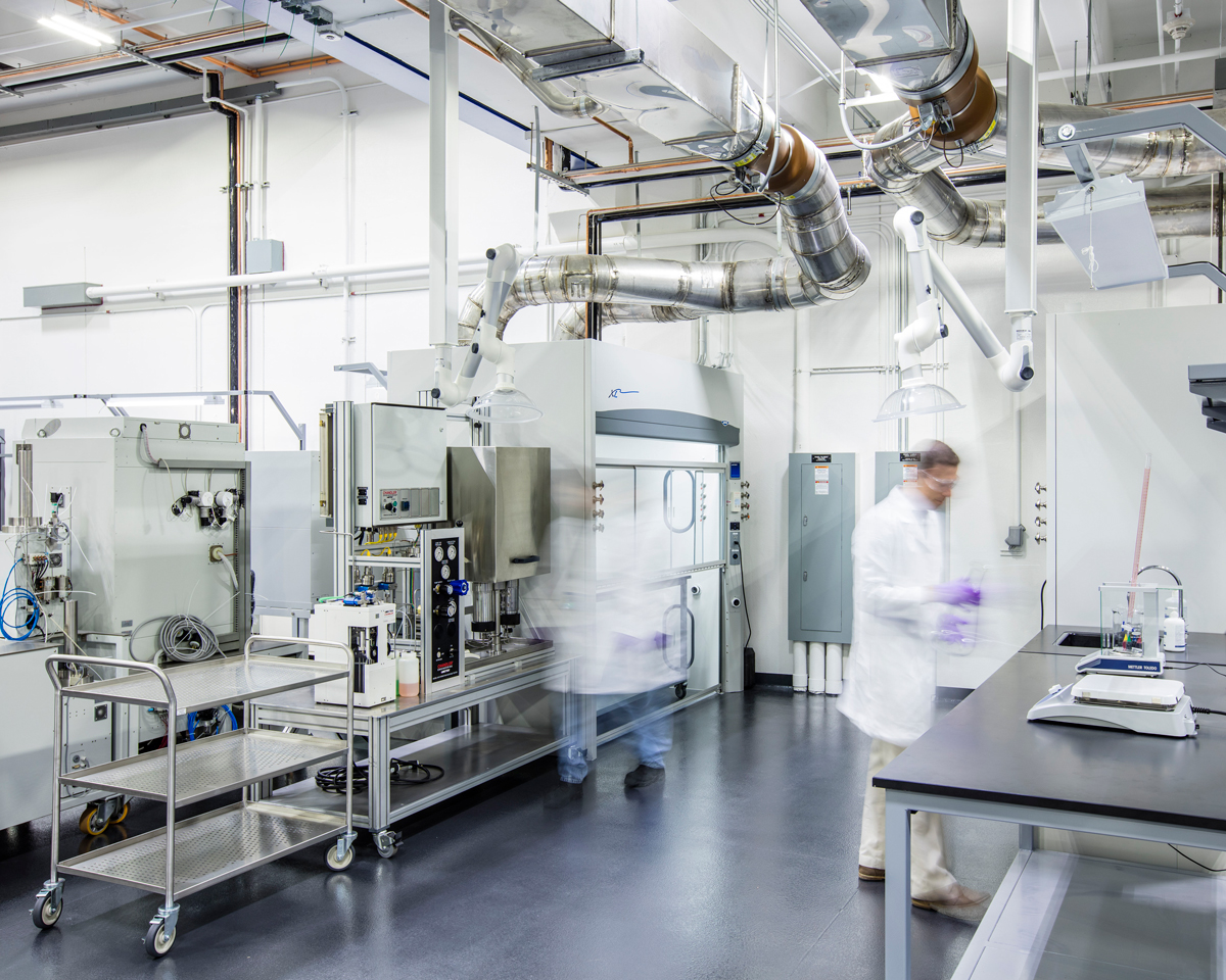 Busy researchers in sterile lab environment